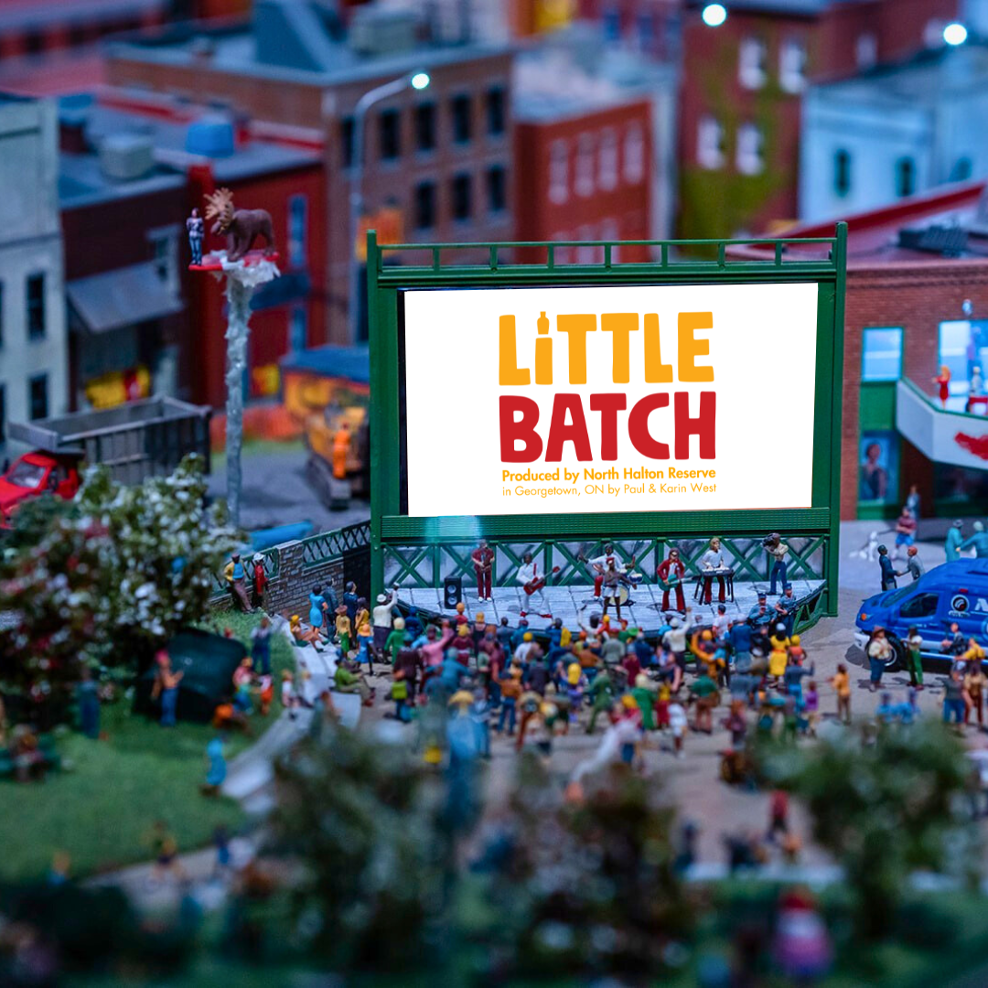 A miniature scenes of a screen with figures placed on the stage.