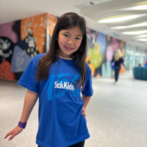 A girl in a blue shirt.